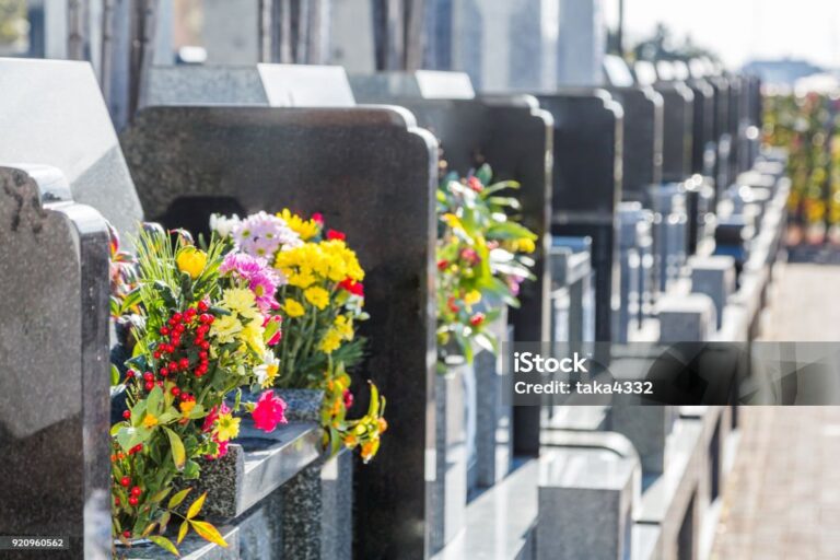 Cemetery tombstones and flowers